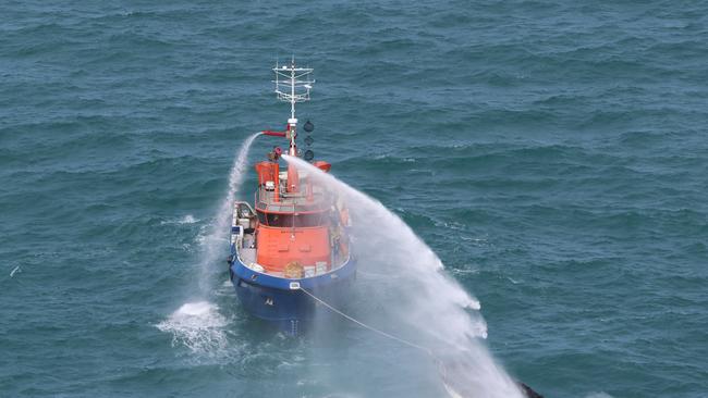 A Fremantle Port Authority response vessel went out to the burning boat and extinguished the flames with water cannons. Picture: Surf Life Saving WA