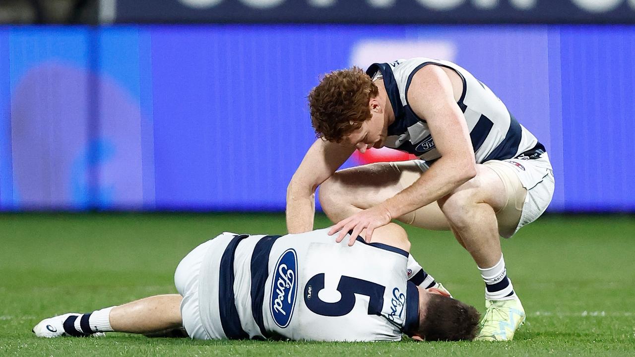 GEELONG, AUSTRALIA - JUNE 22: Jeremy Cameron of the Cats and Gary Rohan of the Cats are seen as Cameron lays injured during the 2023 AFL Round 15 match between the Geelong Cats and the Melbourne Demons at GMHBA Stadium on June 22, 2023 in Geelong, Australia. (Photo by Michael Willson/AFL Photos via Getty Images)