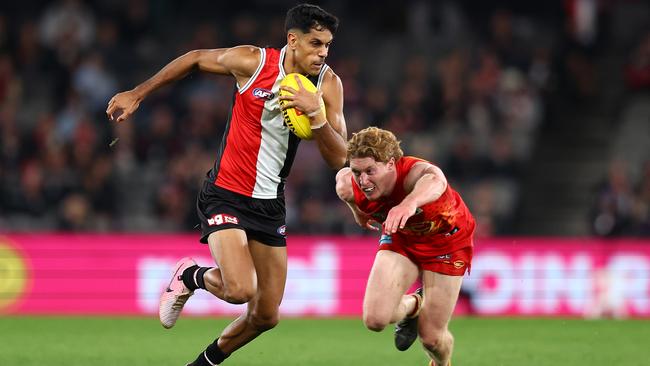 MELBOURNE, AUSTRALIA - JUNE 08: Nasiah Wanganeen-Milera of the Saints is tackled by Matt Rowell of the Suns during the round 13 AFL match between St Kilda Saints and Gold Coast Suns at Marvel Stadium on June 08, 2024 in Melbourne, Australia. (Photo by Graham Denholm/Getty Images)