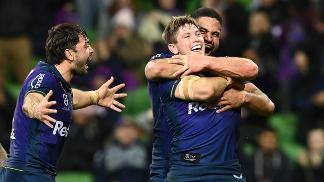 Harry Grant celebrates scoring a try with his Storm teammates.