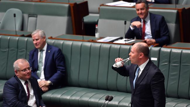 ”Lucky I’ve got some water,” Josh Frydenberg quipped as he tried to stop his coughing fit. Picture: Getty Images.