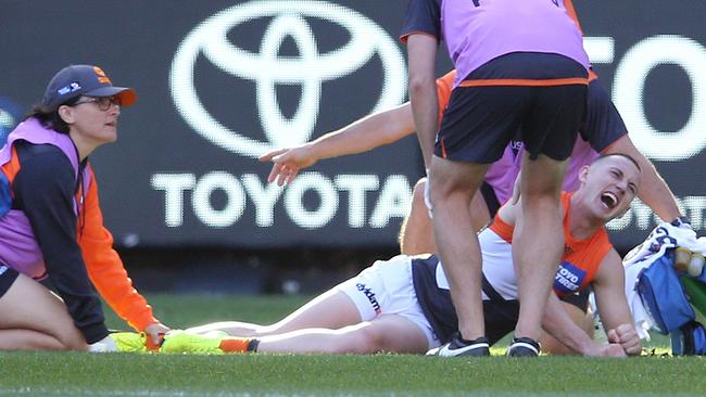 Tom Scully lets out a scream after hurting his ankle. Picture: Michael Klein