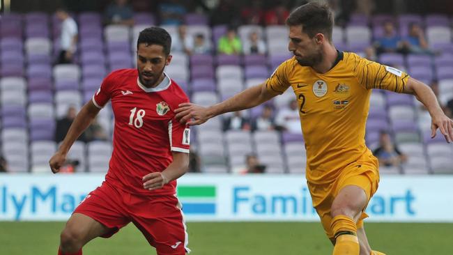 Australia's defender Milos Degenek (R) fights for the ball with Jordan's forward Musa Suleiman during the 2019 AFC Asian Cup football game between Australia and Jordan at the Hazza Bin Zayed stadium in Al-Ain on January 6, 2019. (Photo by KARIM SAHIB / AFP)