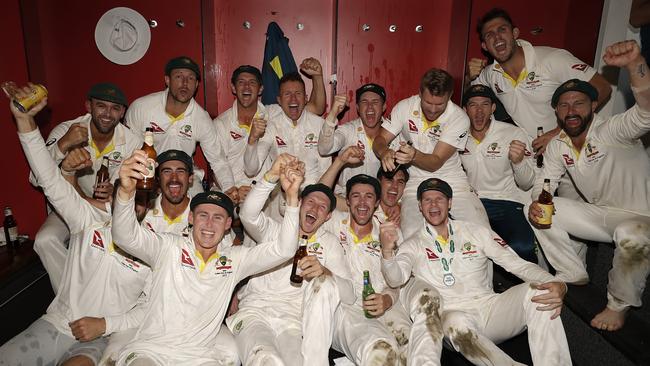 The Australia cricket team celebrates in the Old Trafford change rooms after securing the Ashes with victory in the fourth Test. Picture: Getty Images