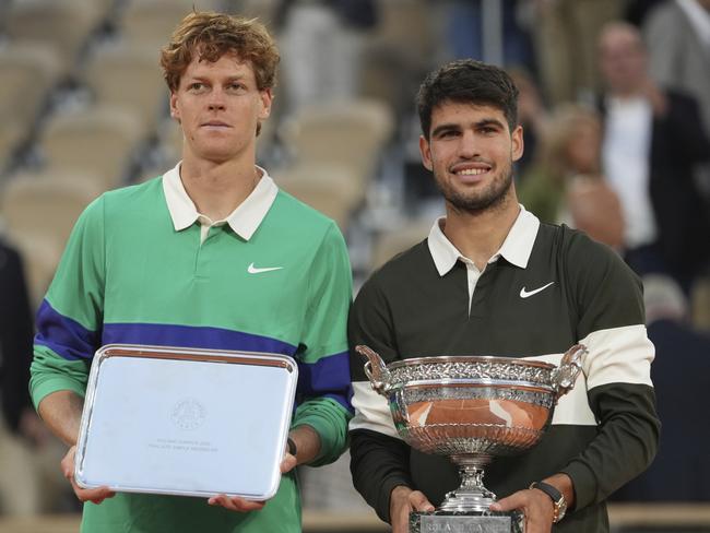 Winner Carlos Alcaraz, right, and runner-up Jannik Sinner pose with their trophies after the French Open final. Picture: AP