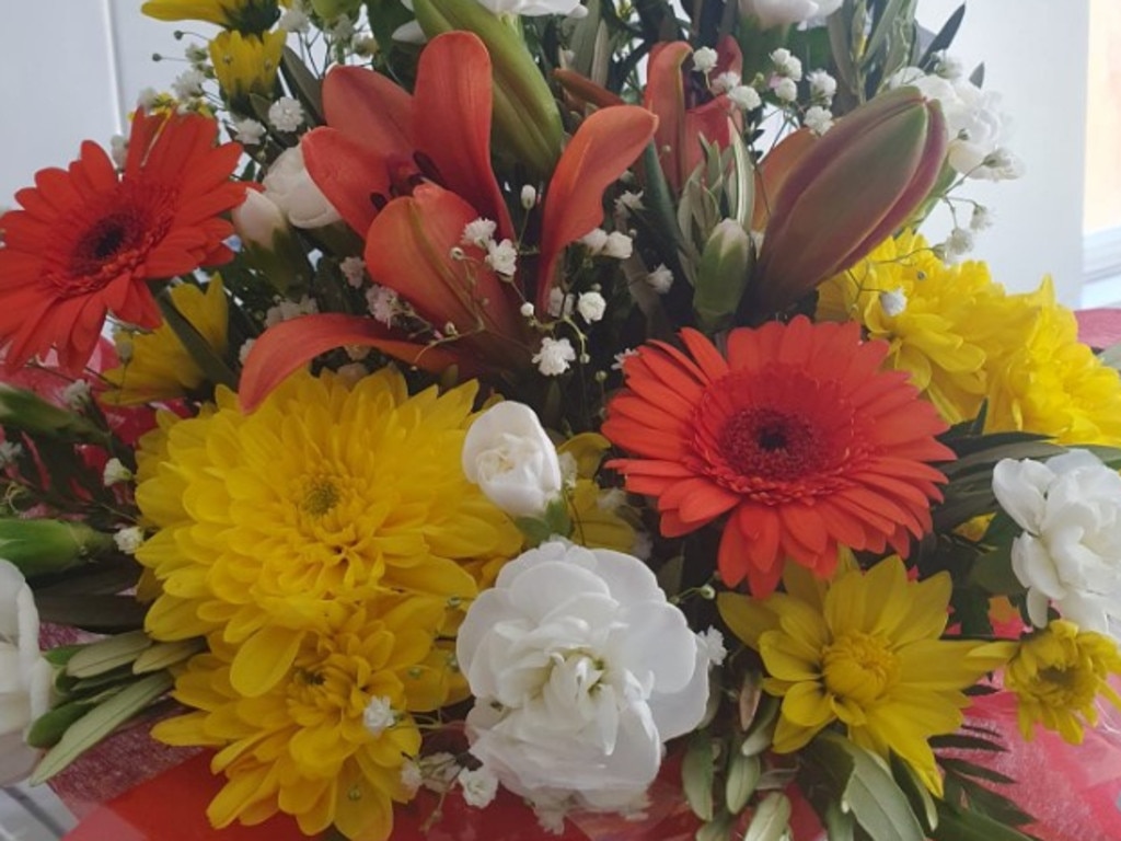 Bundaberg's Shalom College and Community left flowers at the studio after the alleged stabbing attack on Monday afternoon. Picture: Supplied