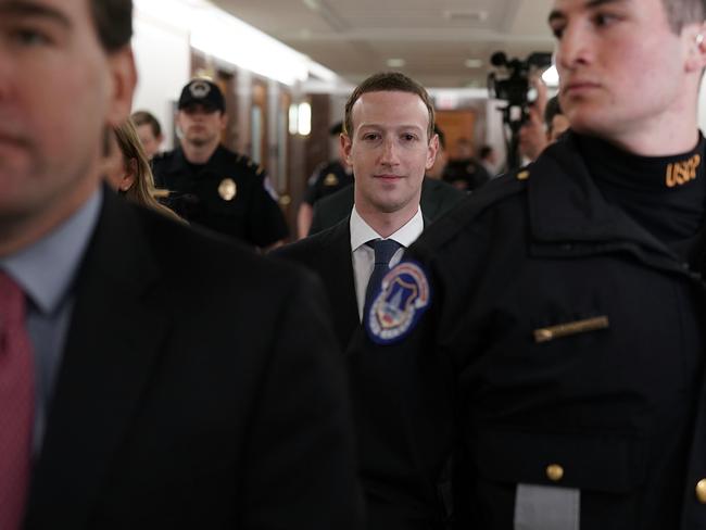 Facebook CEO Mark Zuckerberg (C) is escorted by US Capitol Police in Washington DC. Picture: Getty