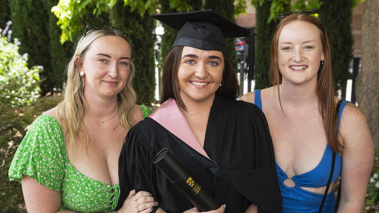 Bachelor of Education (Primary) graduate Tia Bankier with friends Haylee Flynn (left) and Tanika Flynn at a UniSQ graduation ceremony at The Empire, Tuesday, October 29, 2024. Picture: Kevin Farmer