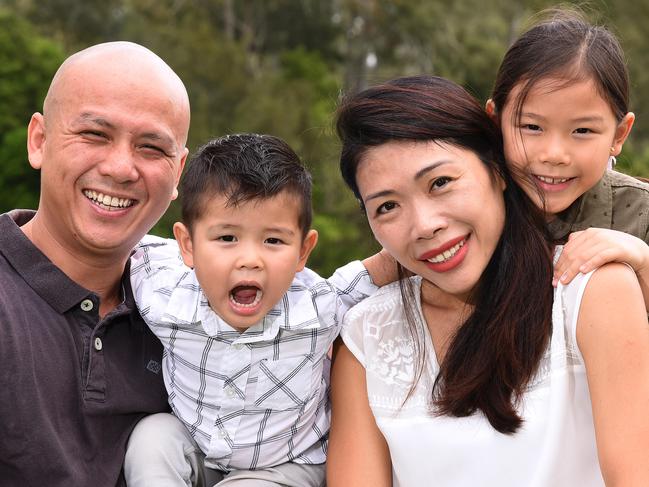 Joe Lam, Caroline Toh with kids , Livi Lam age 7 and Liam Lam age 3 pose for a photograph at the Jindalee boat ramp in Mount Ommaney. Health insurance payments are expected to go up, the Toh family already find health insurance costly with having two young children.Sunday March 25, 2018. (AAP image, John Gass)