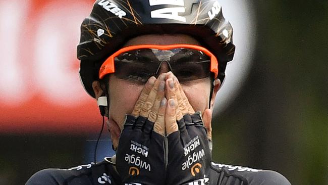 Australia's Chloe Hosking celebrates as she crosses the finish line winning the third edition of La Course by Le Tour de France on the Champs Elysees avenue in Paris.