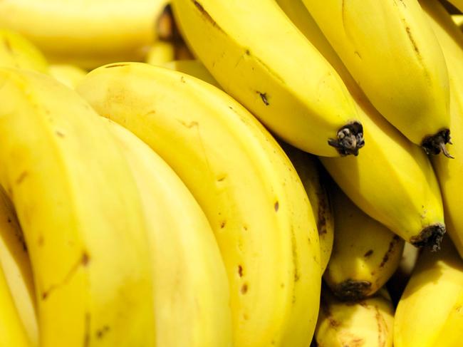 Bananas in a supermarket in Canberra, Tuesday, Sept. 27, 2011. The price of bananas is set to drop as growers recover from cyclone Yasi. (AAP Image/Alan Porritt) NO ARCHIVING