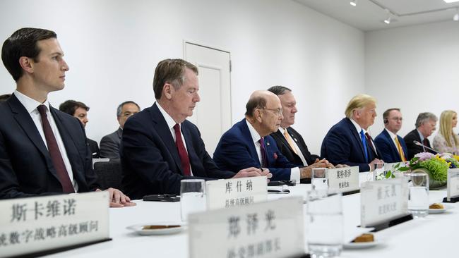 (L-R) Senior Advisor Jared Kushner, US Trade Representative Robert Lighthizer, US Secretary of Commerce Wilbur Ross, US Secretary of State Mike Pompeo, US President Donald Trump, acting White House Chief of Staff Mick Mulvaney, National Security Advisor John R. Bolton, and Ivanka Trump attend a bilateral meeting with China's President Xi Jinping on the sidelines of the G20 Summit in Osaka in 2019.