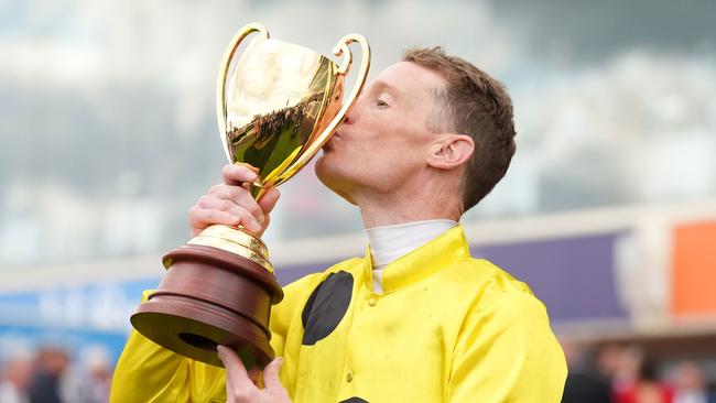 Mark Zahra was fined $50,000 and suspended for overusing the whip in his Caulfield Cup win. Picture: Scott Barbour/Racing Photos via Getty Images