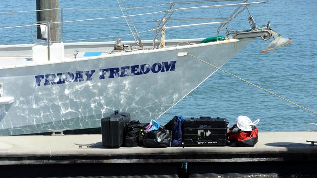 BIG TIME BUST: Australian Federal Police and Customs officials swoop on Friday Freedom at the Port Marina to inspect what is allegedly said to be a massive concealment of drugs. Photo: Max Fleet/NewsMail