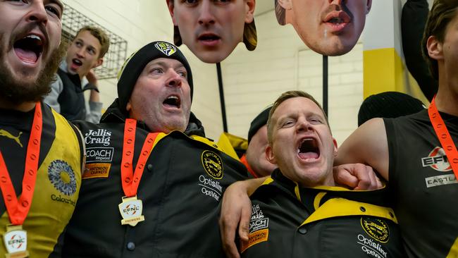 EFNL 2024: Mitcham coach Neil Winterton (third from left) belts out the song after the Division 1 GF. Picture: Leesa Clarkson