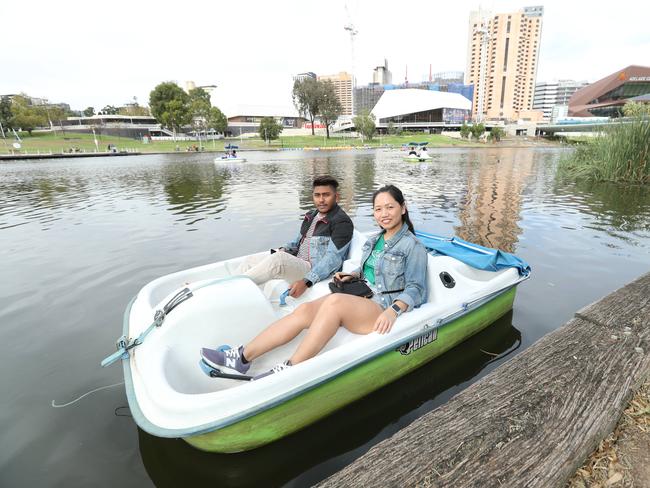 19.4.2019.Government funding to clean up the Torrens. Tourists Mark and Sujana Gurung enjoying the Torrens.  PIC TAIT SCHMAAL.