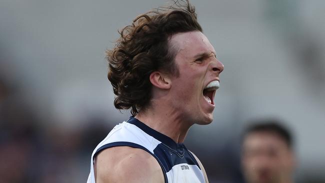 GEELONG, AUSTRALIA - MAY 06: Max Holmes of the Cats celebrates after scoring a goal during the round eight AFL match between Geelong Cats and Adelaide Crows at GMHBA Stadium, on May 06, 2023, in Geelong, Australia. (Photo by Robert Cianflone/Getty Images)