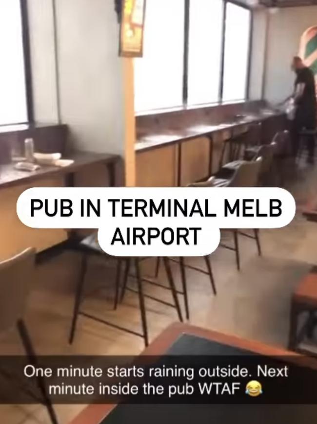 Water floods through the roof of a Terminal 1 pub at Melbourne Airport. Picture: Jacqui Felgate