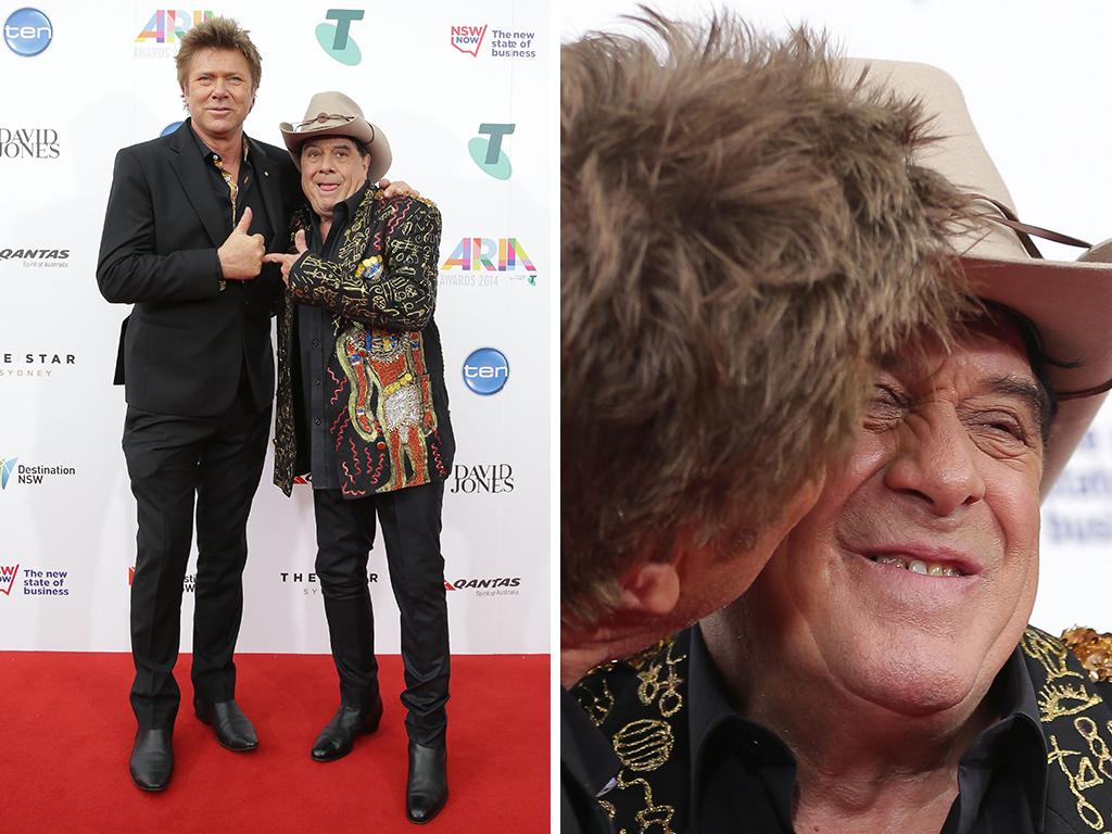 Richard Wilkins and Molly hug it out on the red carpet at the ARIA Awards 2014 in Sydney, Australia. Pictures: Getty