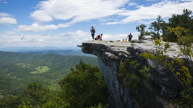 Hikers on McAfee Knob, a lookout on the Appalachian Trail.