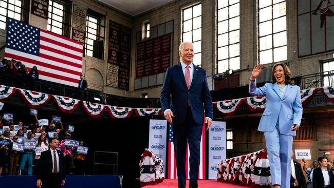 US President Joe Biden and Vice President Kamala Harris enter for a campaign event at Girard College in Philadelphia.