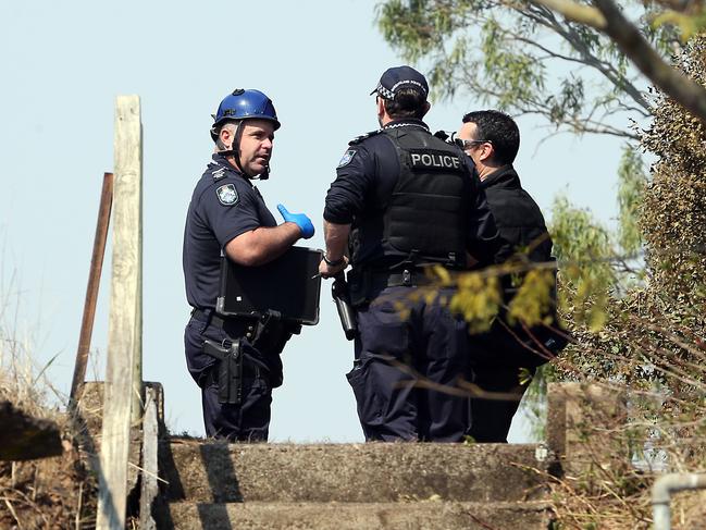 Police at the scene of the blaze this morning. Picture: AAP/Richard Gosling