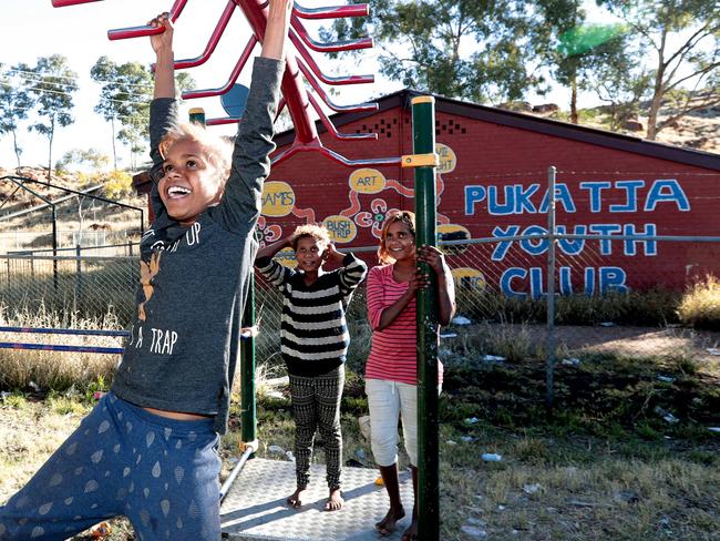 Jermima Evans with Ethel and Dreshelle Doolan at a playground at Pukatja in the APY lands. Picture: Dylan Coker