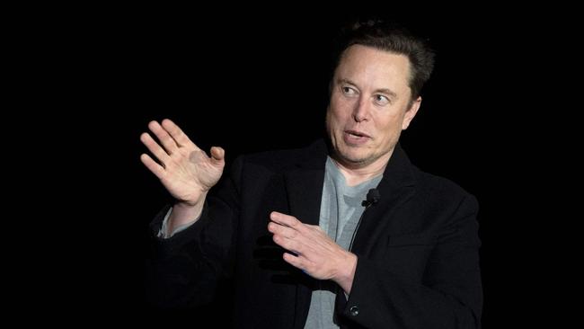 Elon Musk gestures as he speaks during a press conference at SpaceX's Starbase facility near Boca Chica Village in South Texas on February 10, 2022. - Billionaire entrepreneur Elon Musk delivered an eagerly-awaited update on SpaceX's Starship, a prototype rocket the company is developing for crewed interplanetary exploration. (Photo by JIM WATSON / AFP)