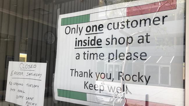 The Plaza Barber Shop is normally a hive of gossip in Manly, but now just one customer is allowed in at a time. Picture: Julie Cross