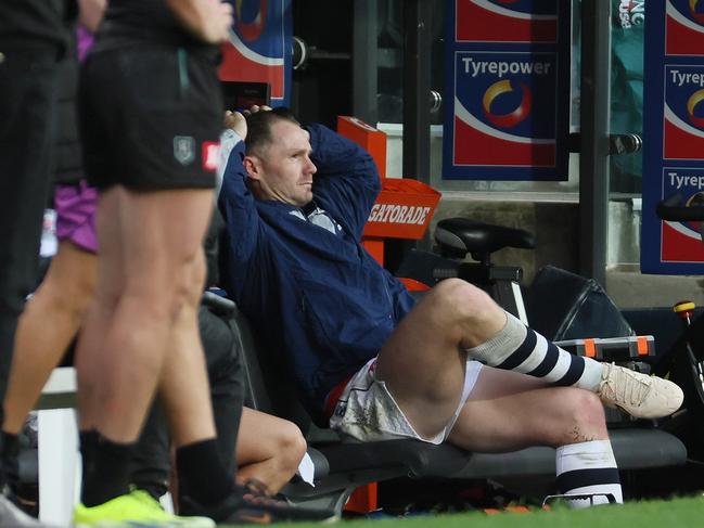Patrick Dangerfield of the Cats sits on the bench after being taken out of the game. Picture: James Elsby/AFL Photos via Getty Images