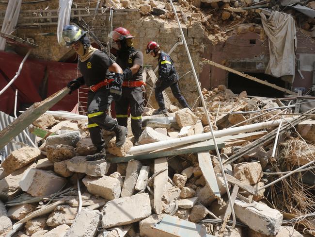 Emergency workers search a collapsed building on August 6, 2020 in Beirut, Lebanon. On Thursday, the official death toll from Tuesday's blast stood at 137, with thousands injured. Picture: Getty