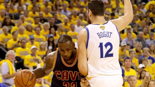 LeBron James and Andrew Bogut clash in last season’s NBA finals.