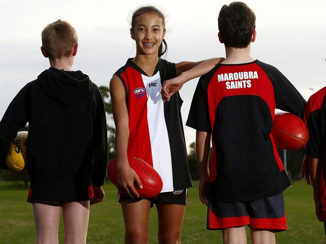 Sienna Reiners -12  , with some of her teams mates from the Mixed team. Sienna plays with both the boys and girls at Maroubra Saints Australian Rules Football  club, playing in both the mixed team and above her age in the U15's. Local Sports Star. Picture: John Appleyard