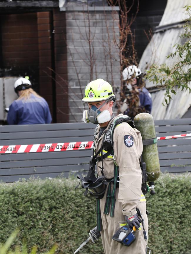 Firefighters at the scene of the deadly blaze. Picture: David Crosling