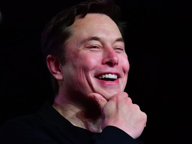 (FILES) In this file photo taken on March 14, 2019 Tesla CEO Elon Musk reacts during the unveiling of the new Tesla Model Y in Hawthorne, California. - Another zany tweet or a real question? Elon Musk polled his more than 62 million Twitter followers Saturday about whether he should sell 10 percent of his Tesla shares, insisting he would do as voters say. The over-the-top electric car maker's query follows a proposal by Congressional Democrats to tax the super-wealthy more heavily by targeting stocks, which are usually only taxed when sold. (Photo by Frederic J. BROWN / AFP)