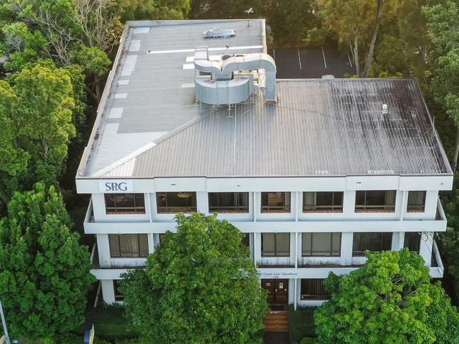 Three-level building, on the corner of Bundall Rd and Crombie Ave, occupied by the Short Punch and Greatorix practice.