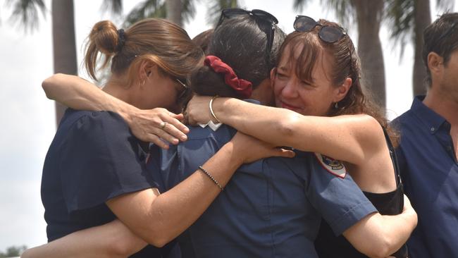 Leslie O'Hagan's granddaughter, Lily Lucend and daughter Donna Renshaw, comfort each other at the service. Picture: Sierra Haigh