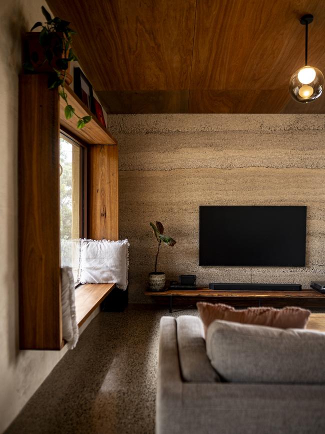 The lounge room with an exposed hempcrete wall. Picture: Brad Harris