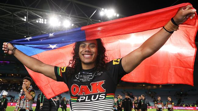 Winners are grinners. Jarome Luai of the Panthers celebrates with the Samoa flag.