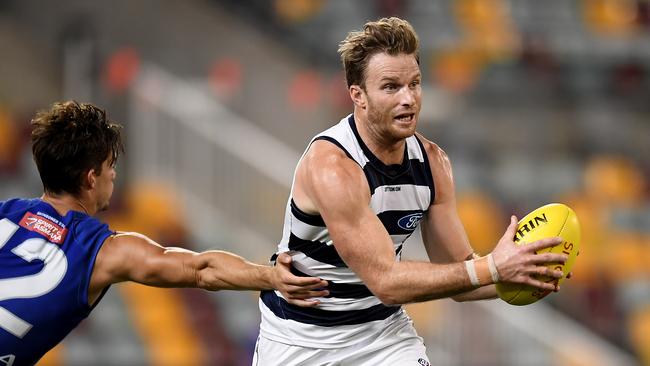 Lachie Henderson has looked rock solid down back for the Cats. Picture: Albert Perez/AFL Media/via Getty Images