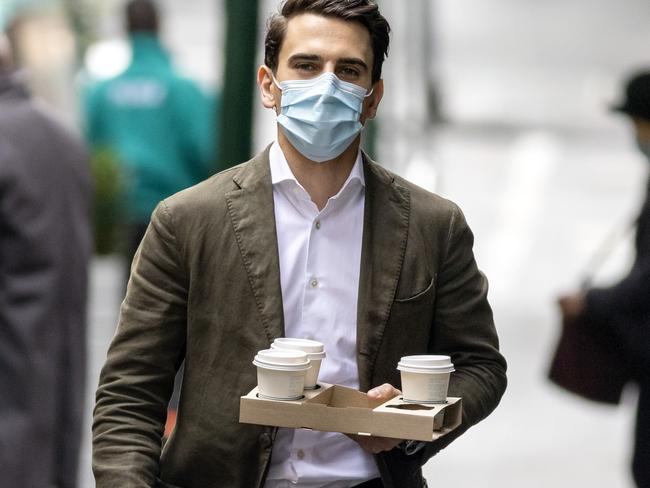 MELBOURNE, AUSTRALIA - NewsWire Photos JUNE 16, 2021: People get around Melbourne CBD wearing face masks as it is still mandatory to wear masks outdoors in Victoria. Picture: NCA NewsWire / David Geraghty