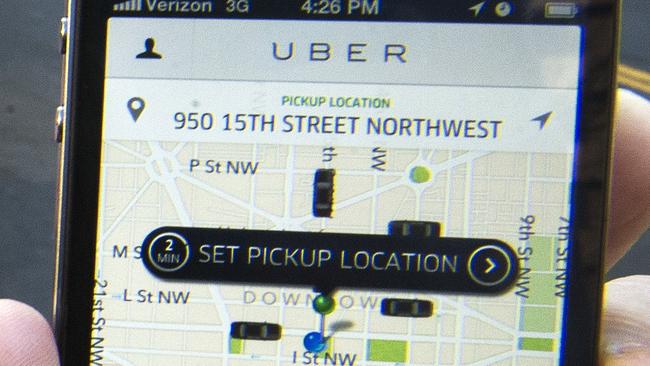 (FILES) The Uber App is shown in this February 14, 2013, file photo in Washington, DC. Uber teamed up with dining and travel smartphone applications on August 20, 2014, as the controversial Internet-age car-hailing service moved to park itself at the heart of mobile lifestyles. The San Francisco-based startup let about a dozen businesses such as Starbucks, Hyatt Hotels, United Airlines, TripAdvisor and restaurant reservation service OpenTable make it simple for people to summon Uber cars from inside their applications for smartphones or tablet computers. AFP Photo/Paul J. Richards/FILES