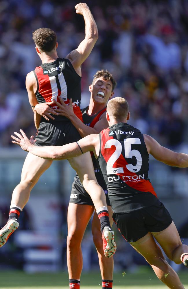 Bombers Jye Caldwell and Jake Stringer celebrate Jade Gresham’s final-quarter goal. Picture: Michael Klein