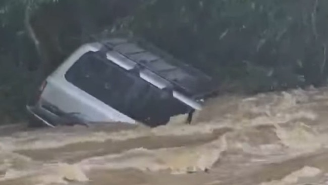 Images of a 4WD half submerged at Amamoor Crossing Creek Number Eight, in the Mary Valley. Pictures: Carla Nerea, Facebook.