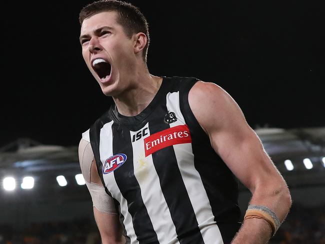 AFL Round 17. 14/09/2020. ..  Collingwood vs Gold Coast Suns at the Gabba, Brisbane .   Mason Cox of the Magpies celebrates his goal in the fourth quarter   . Pic: Michael Klein