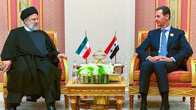 Iran's late resident Ebrahim Raisi meets Syria's president Bashar al-Assad during the emergency meeting of the Arab League and the Organisation of Islamic Cooperation (OIC) in Riyadh. Picture: AFP.