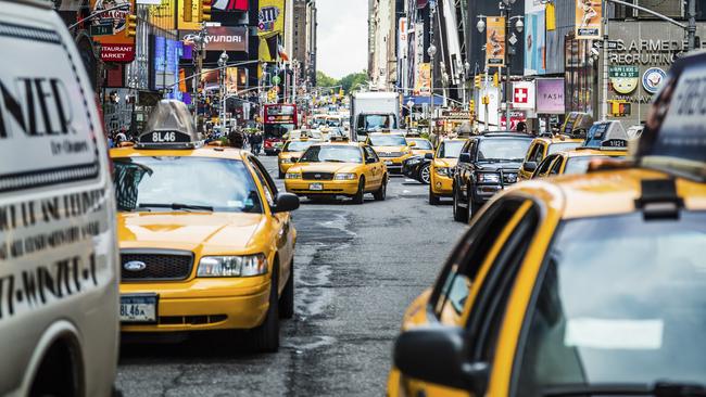 Heavy traffic on busy famous 7th Avenue near Times Square in New York.