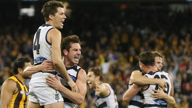 Geelong players celebrate after Isaac Smith’s shot at goal after the final siren missed. Pic: Michael Klein