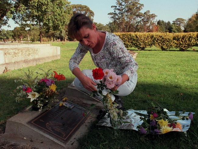 Julie Maybury visiting the grave of her daughter in 1997.