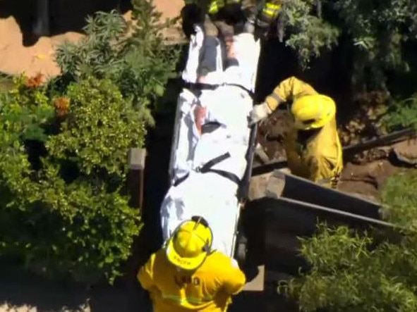 Emergency services personnel with Heche shortly after the accident. Picture: Fox 11